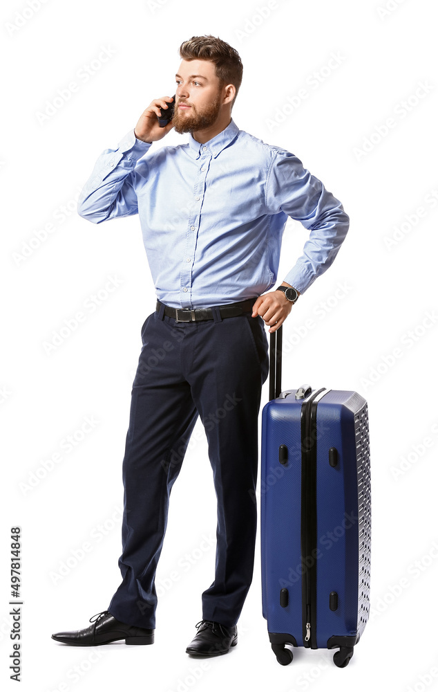 Handsome businessman with blue suitcase talking by mobile phone on white background Handsome businessman with blue suitcase talking by mobile phone on white background