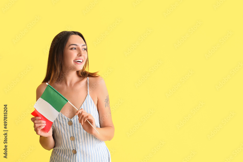 Beautiful young woman with Italian flag on yellow background Beautiful young woman with Italian flag on yellow background