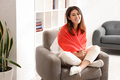 Young Asian woman with flag...