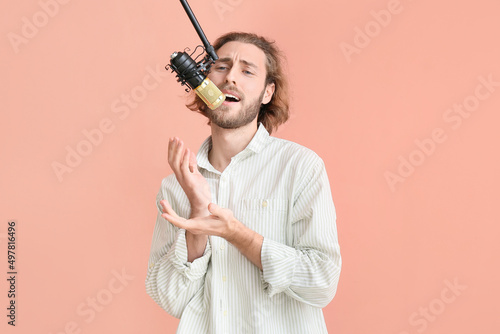 Handsome young man singing ...