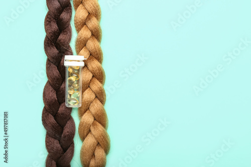 Braided hair with pills on blue background