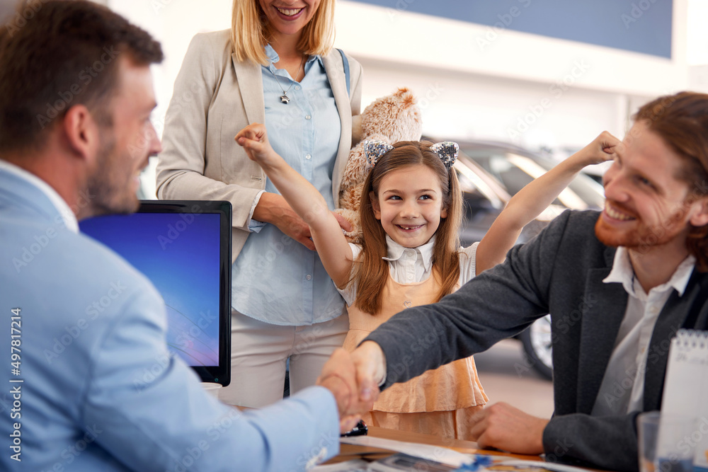 Happy family buying a new car