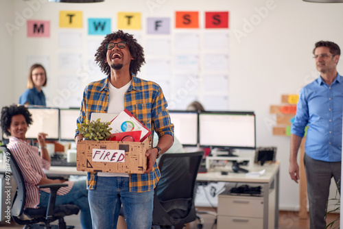 Fotografi A young male office worker is happy because he got fired from the job