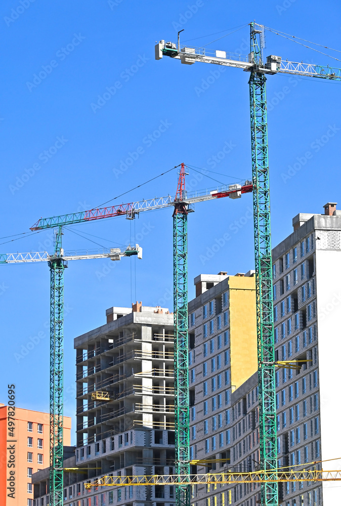 Crane and highrise construction site Crane and highrise construction site