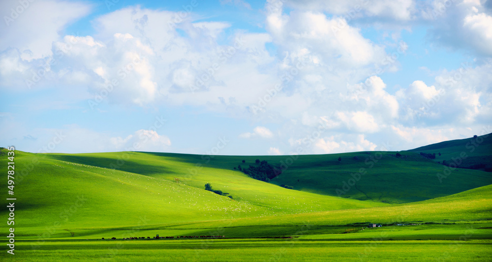 Hills, grasslands and blue sky