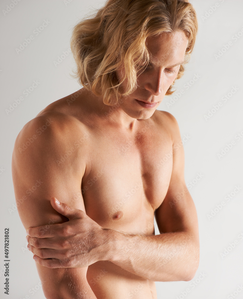He practices a healthy lifestyle. Studio shot of a handsome young shirtless man. He practices a healthy lifestyle. Studio shot of a handsome young shirtless man.
