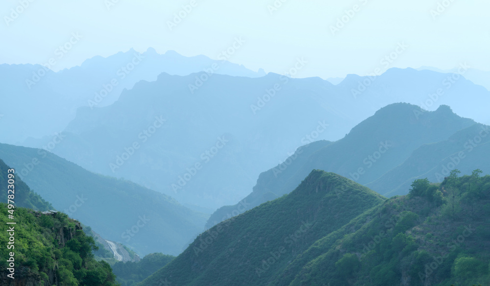 View of misty fog mountains in summer