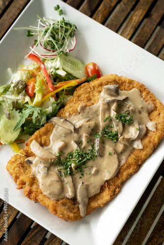 Obraz na plátně german veal Jagerschnitzel schnitzel cutlet with mushroom sauce and salad