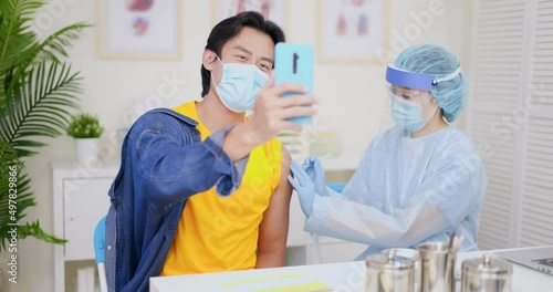 man takes selfie when vaccination photo