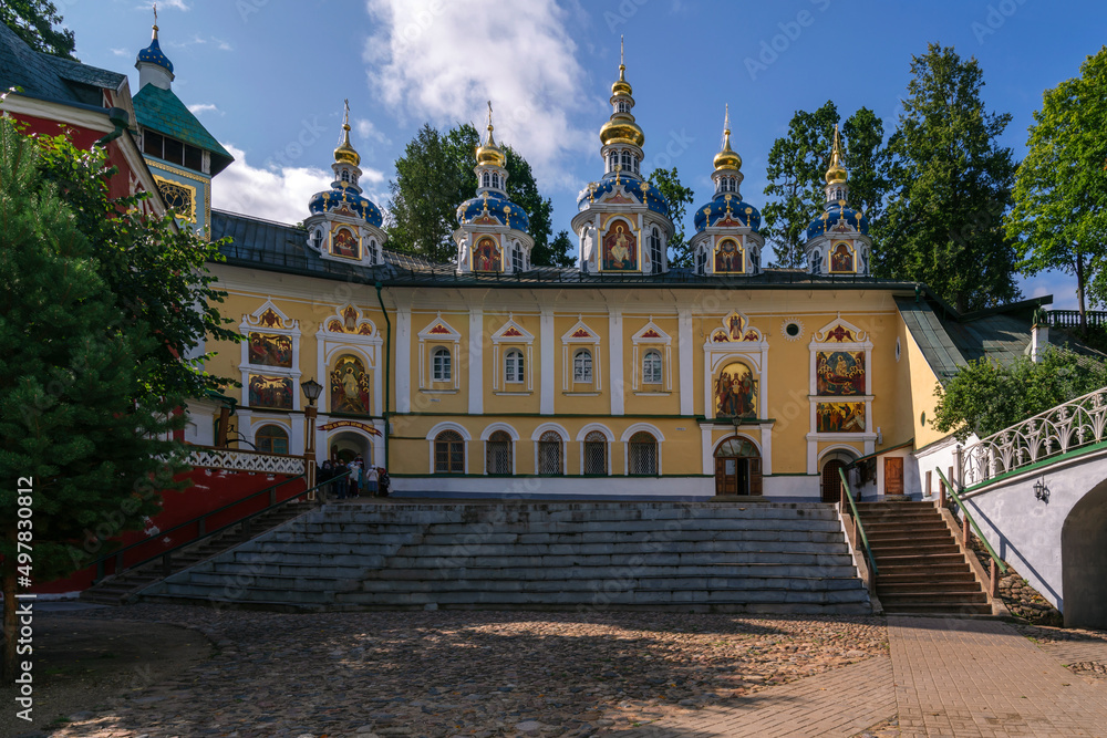 View of the Assumption Cave and the Intercession Church in the Svyato-Uspenskiy Pskov-Pechersk Monastery, Pechory, Pskov region, Russia. The inscription: 
