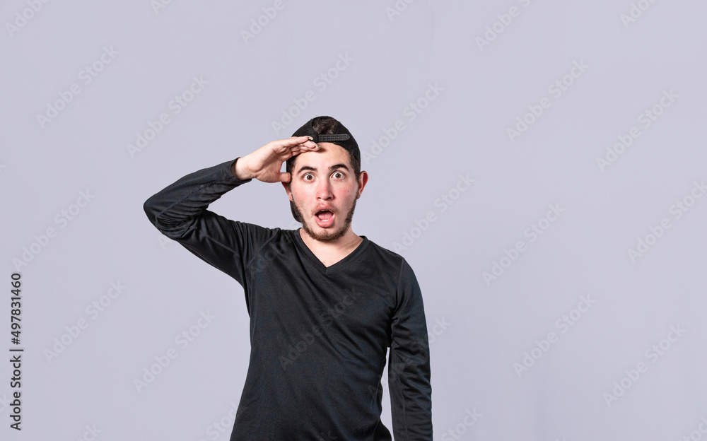 Amazed young man with his mouth open with his hand on his forehead, surprised guy with his mouth open with his hand on his forehead, concept of someone astonished Amazed young man with his mouth open with his hand on his forehead, surprised guy with his mouth open with his hand on his forehead, concept of someone astonished