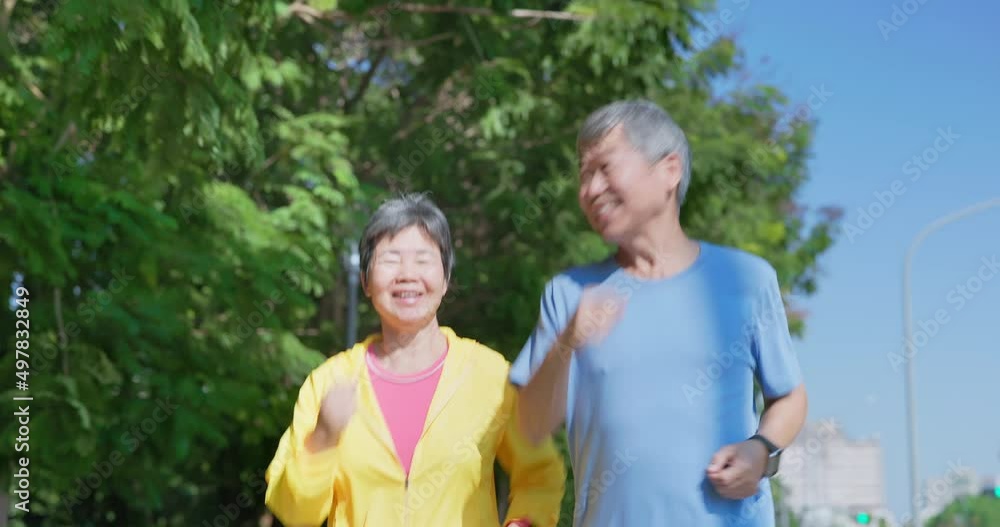 elderly couple run outdoor