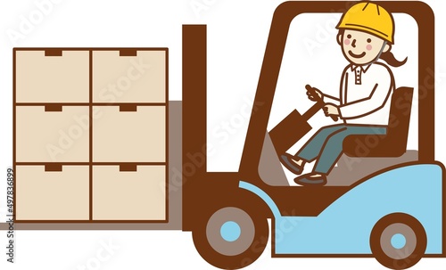 フォークリフトで荷物を運ぶ、女性作業員。