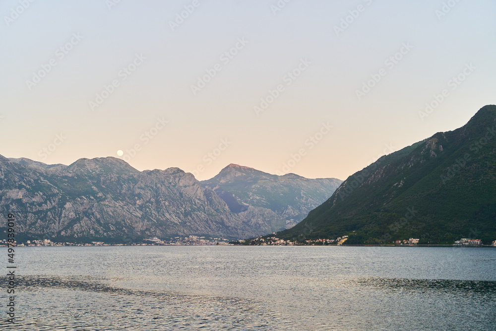 View of the sunset in Boko-Kotor Bay in Montenegro. Silhouettes of mountains
