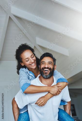 Love makes us light at heart. Shot of a relaxed couple enjoying the day at home together.
