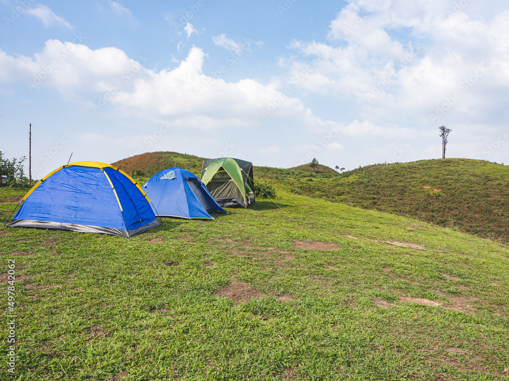 Group tents camping on mountain peak in the tropical forest at Tak Province, Thailand.