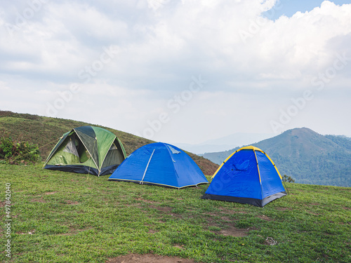 Group tents camping on mountain peak in the tropical forest at Tak Province, Thailand.