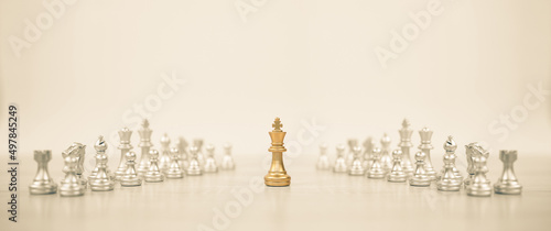 Close-up king chess standing on chessboard concepts of teamwork or volunteer or challenge of business team or wining and leadership strategy and organization risk management or team player.