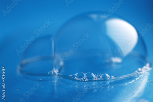 soap bubble close up. abstract blue water background