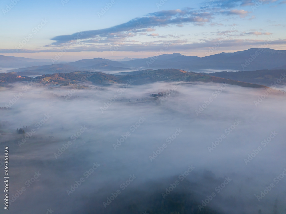Sunrise over the fog in the Ukrainian Carpathians. Aerial drone view. Sunrise over the fog in the Ukrainian Carpathians. Aerial drone view.