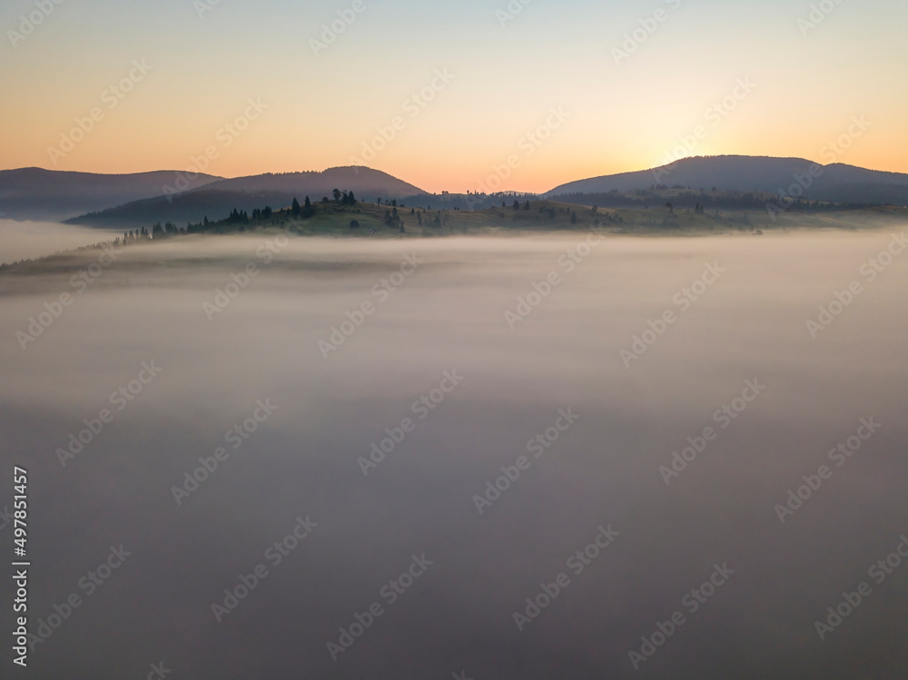 Morning fog in the Ukrainian Carpathians. Aerial drone view. Morning fog in the Ukrainian Carpathians. Aerial drone view.