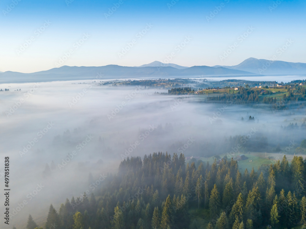 Morning fog in the Ukrainian Carpathians. Aerial drone view. Morning fog in the Ukrainian Carpathians. Aerial drone view.