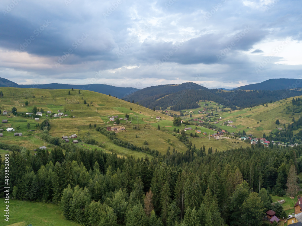Fototapeta premium Green Ukrainian Carpathians mountains in summer. Aerial drone view.