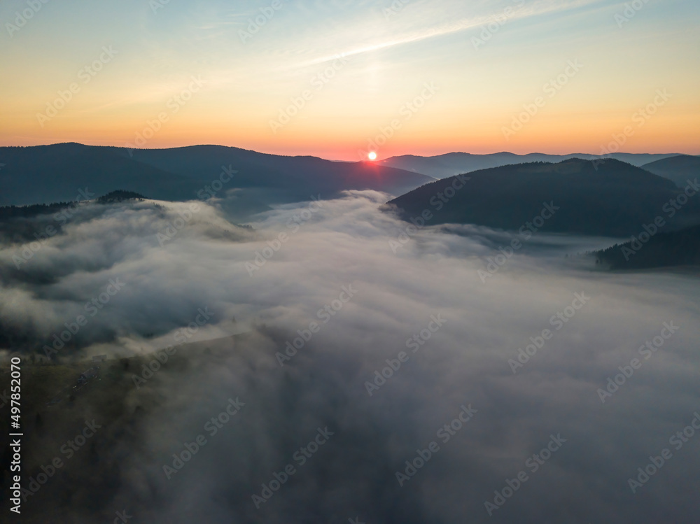 Sunrise over the fog in the Ukrainian Carpathians. Aerial drone view. Sunrise over the fog in the Ukrainian Carpathians. Aerial drone view.