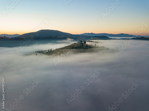 Morning fog in the Ukrainian Carpathians. Aerial drone view.