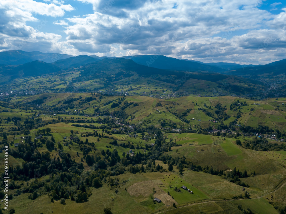 Green mountains of Ukrainian Carpathians in summer. Coniferous trees on the slopes. Aerial drone view. Green mountains of Ukrainian Carpathians in summer. Coniferous trees on the slopes. Aerial drone view.