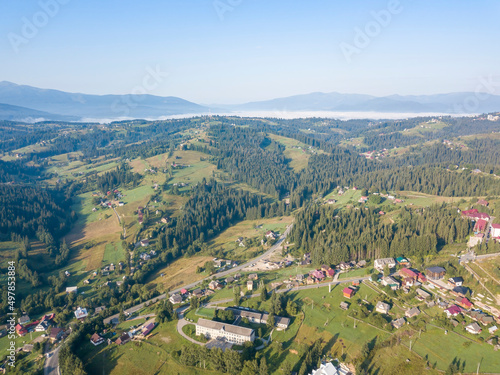 Green mountains of Ukrainian Carpathians in summer. Sunny day. Aerial drone view.