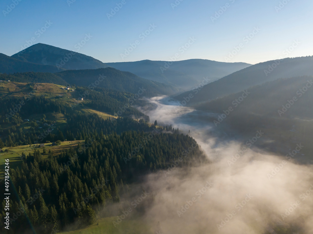 Green mountains of the Ukrainian Carpathians in the morning mist. Aerial drone view. Green mountains of the Ukrainian Carpathians in the morning mist. Aerial drone view.