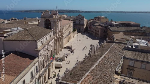 flying counter clockwise reveal of Ortgia Cathedral in Siracusa Sicily photo