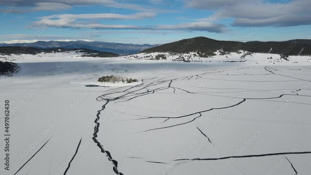 Aerial winter view of Batak Reservoir covered with ice, Pazardzhik Region, Bulgaria Aerial winter view of Batak Reservoir covered with ice, Pazardzhik Region, Bulgaria