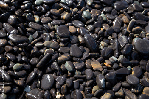 Black Stone at Hin Ngam Island at the Andaman Sea near Koh Lipe, Thailand