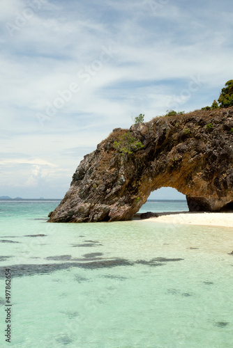 Natural stone arch with  beach at Kho Khai near Tarutao national park and Koh Lipe Thailand