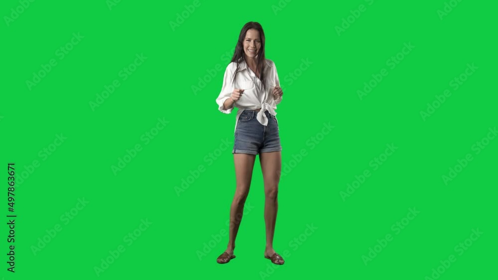 Happy summer stylish girl dancing in super slow motion. Full body isolated on green screen background Happy summer stylish girl dancing in super slow motion. Full body isolated on green screen background