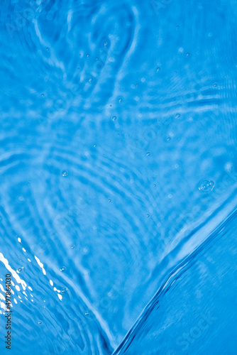 Blue waves ripples and splashes. Blue water texture. Selective focus