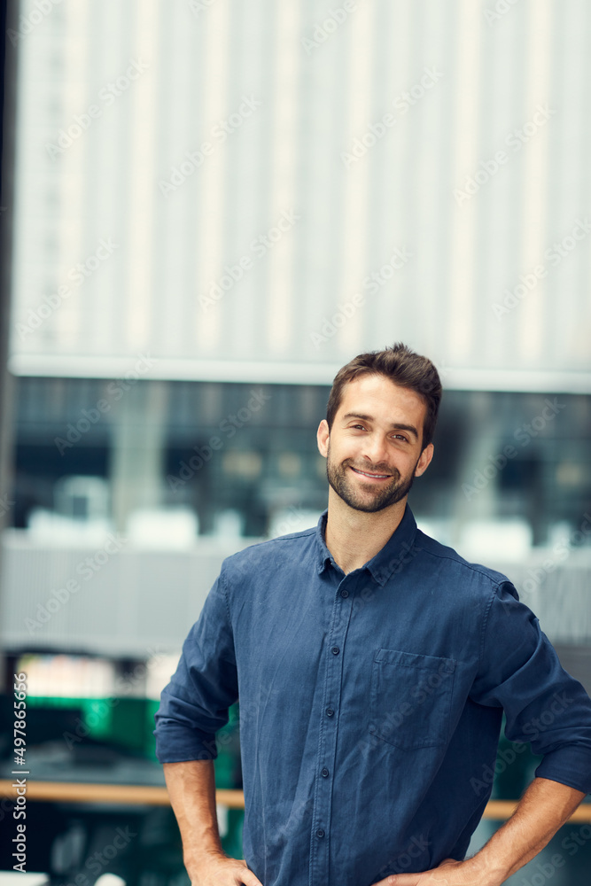 Invest in yourself and youll never fail. Cropped portrait of a handsome young businessman standing alone with hands on his hips during the day. Invest in yourself and youll never fail. Cropped portrait of a handsome young businessman standing alone with hands on his hips during the day.