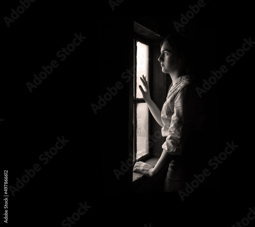 Tablou canvas Woman praying at the window