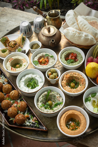 Photography mixed middle eastern meze sharing food platter in turkish restaurant