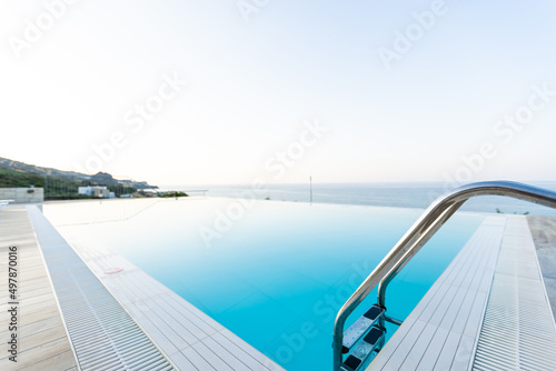 Swimming pool on top of roof deck building. © Angelov
