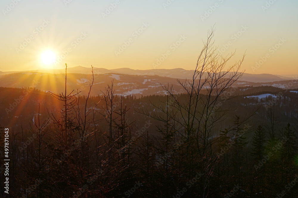Sun set on Silesian Beskid near Bialy Krzyz in Szczyrk in Poland Sun set on Silesian Beskid near Bialy Krzyz in Szczyrk in Poland