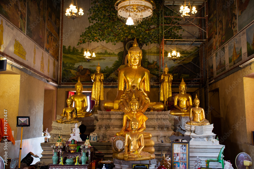 Ancient buddha statue in old ubosot for thai people travelers travel visit and respect praying blessing holy worship in Wat Sak Yai temple at Bang Kruai city on March 15, 2022 in Nonthaburi, Thailand