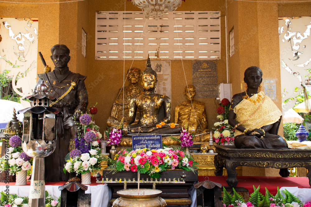 Buddha statue and King Taksin The Great monument for thai people travel visit respect praying blessing holy mystery deity of Wat Sak Yai temple at Bang Kruai on March 15, 2022 in Nonthaburi, Thailand