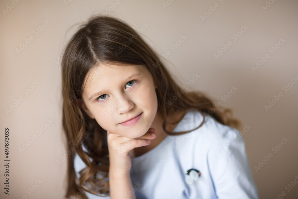 Charming European tender teen girl with long hair, close-up portrait, pastel colors Charming European tender teen girl with long hair, close-up portrait, pastel colors