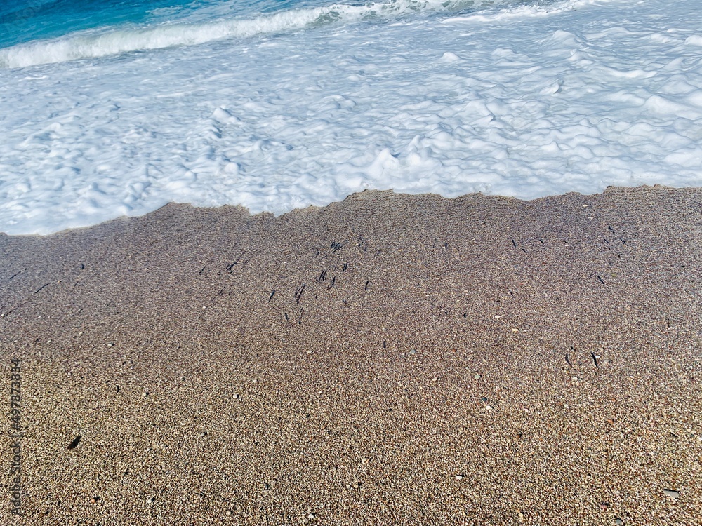 Sand on the beach with a sea wave Sand on the beach with a sea wave