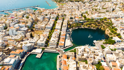 Agios Nikolaos. Agios Nikolaos is a picturesque town in the eastern part of the island Crete built on the northwest side of the peaceful bay of Mirabello. photo