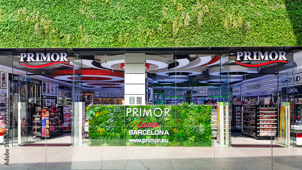 SPAIN, BARCELONA, MARCH, 2022 - Panorama of the green main entrance to the Primor  Cosmetics store in