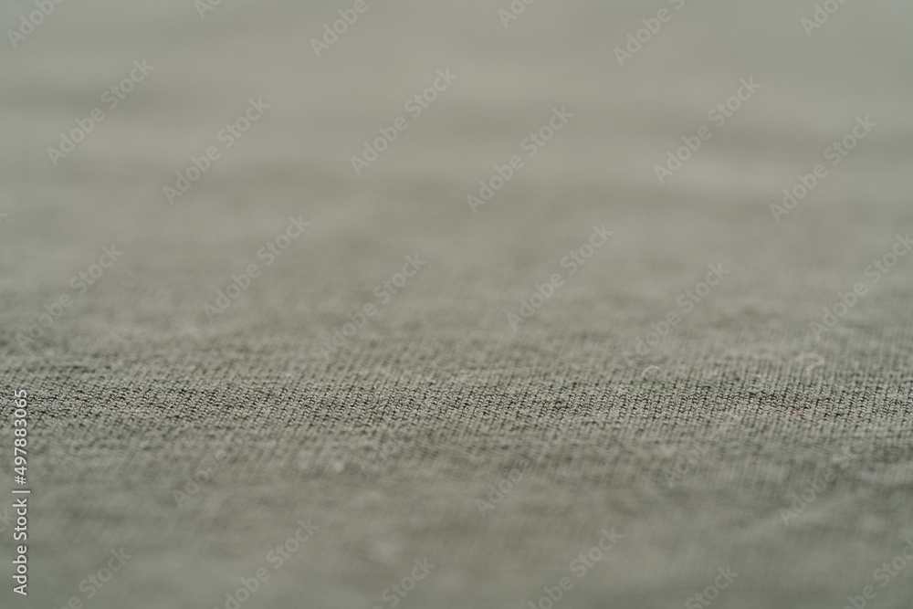 closeup shot of green premium cotton fabric closeup shot of green premium cotton fabric